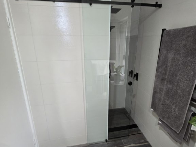 barn door frameless clear glass sliding door - perth - glasscapes